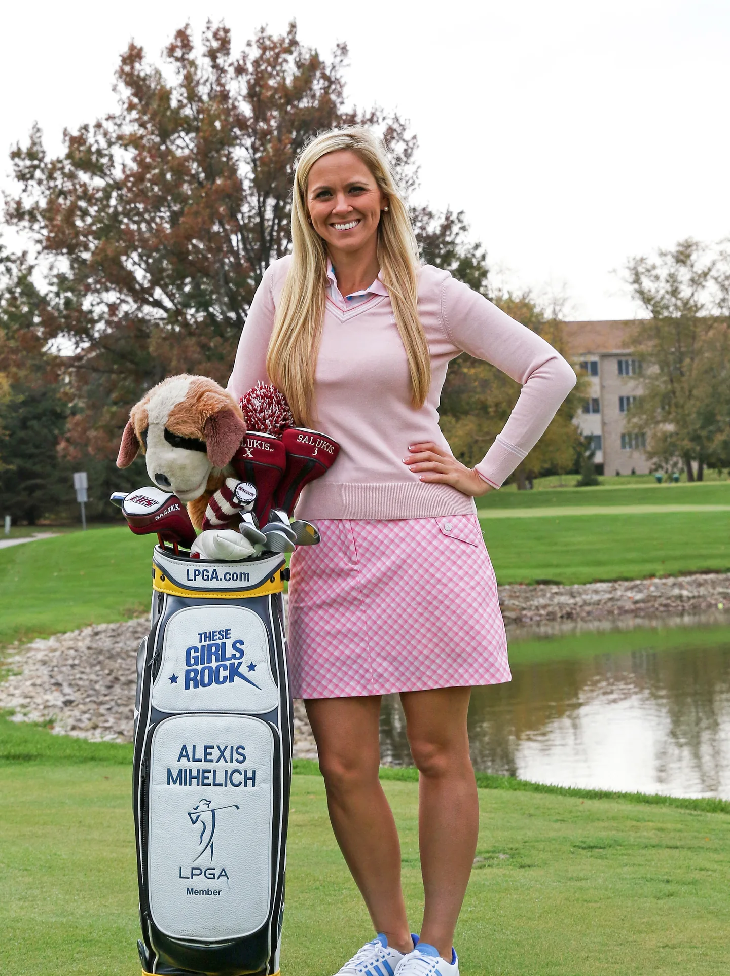 Alexis O’Brien on the course with her golf bag.